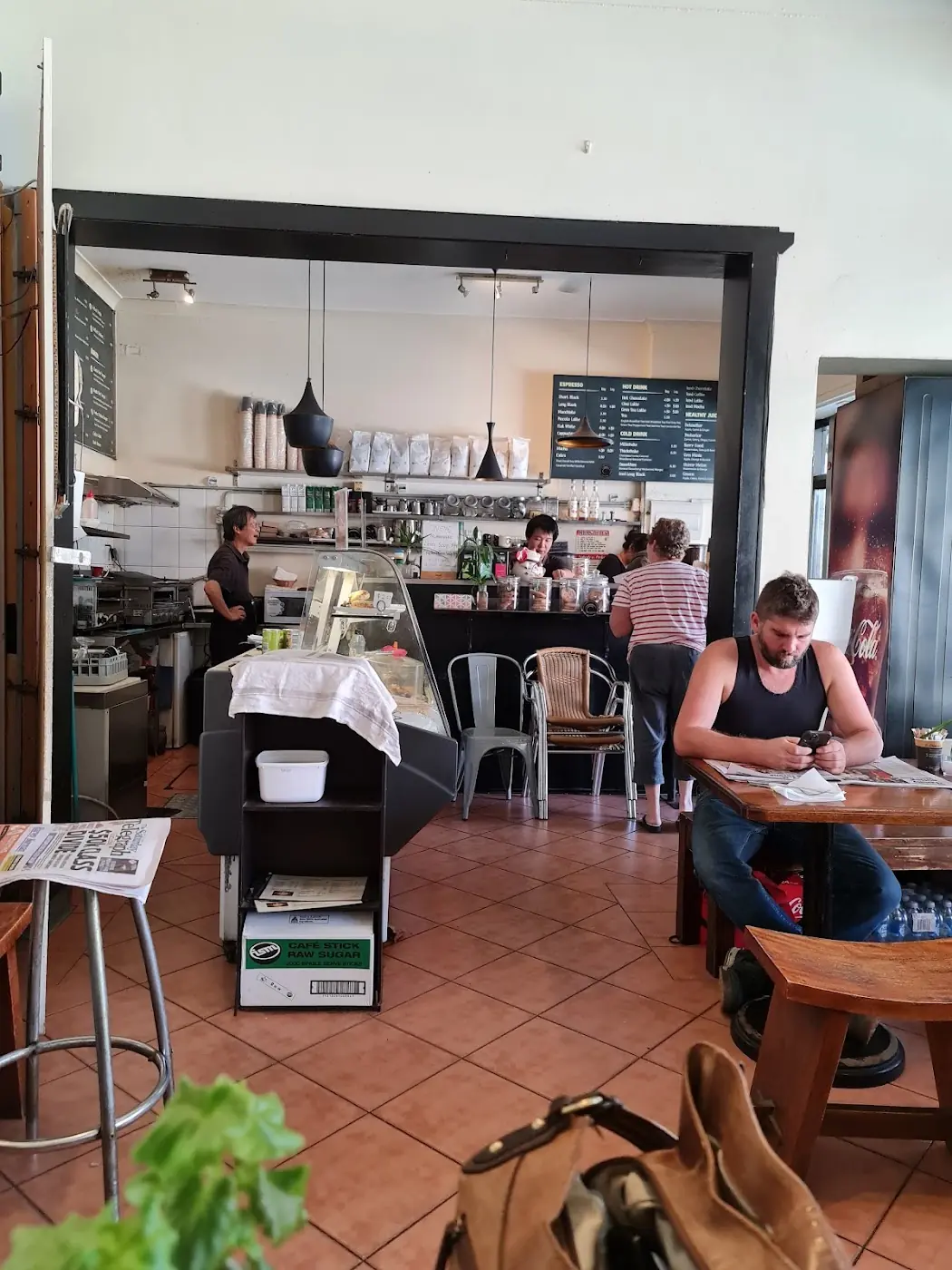 Inside Meeks Cafe, with tables and the counter